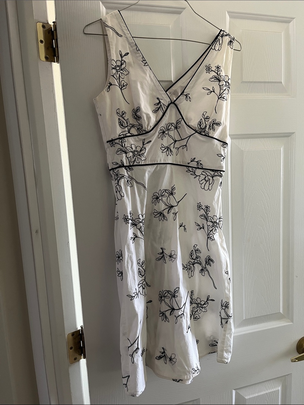 Sleeveless White Floral Midi Dress with Black Trim